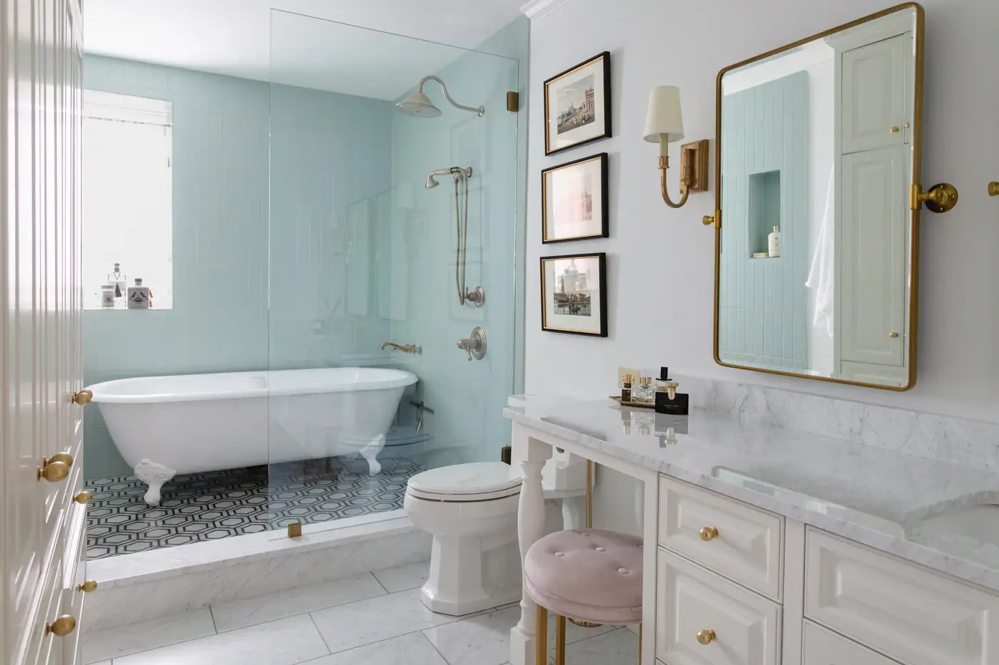 A clawfoot tub against blue tile in a Fort Worth bungalow bath remodel